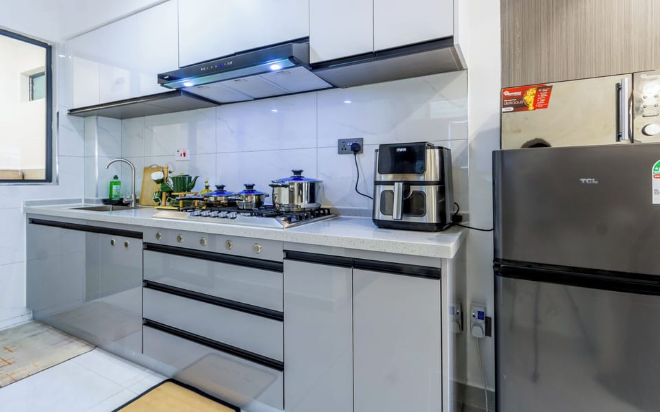 Deluxe Apartment, Balcony, City View | Private kitchen | Coffee/tea maker, electric kettle