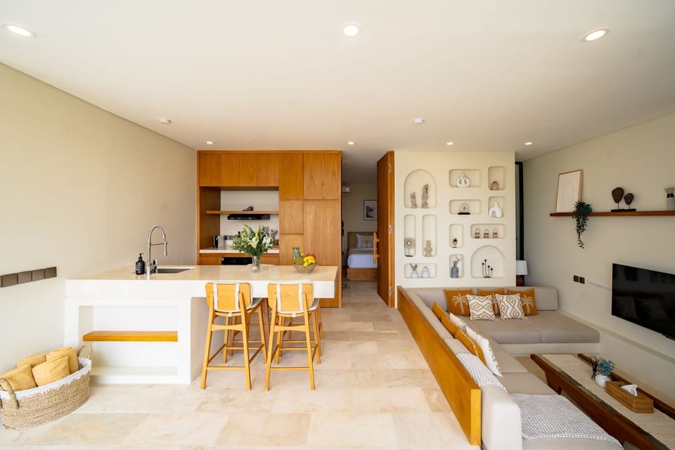 Deluxe Villa, 2 Bedrooms, Patio, Pool View | Living room | 50-inch TV with cable channels