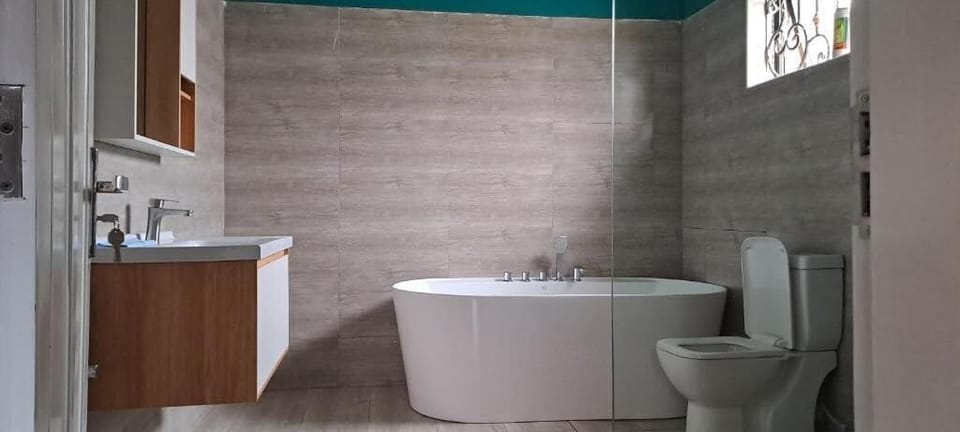 Separate tub and shower, towels, soap, toilet paper