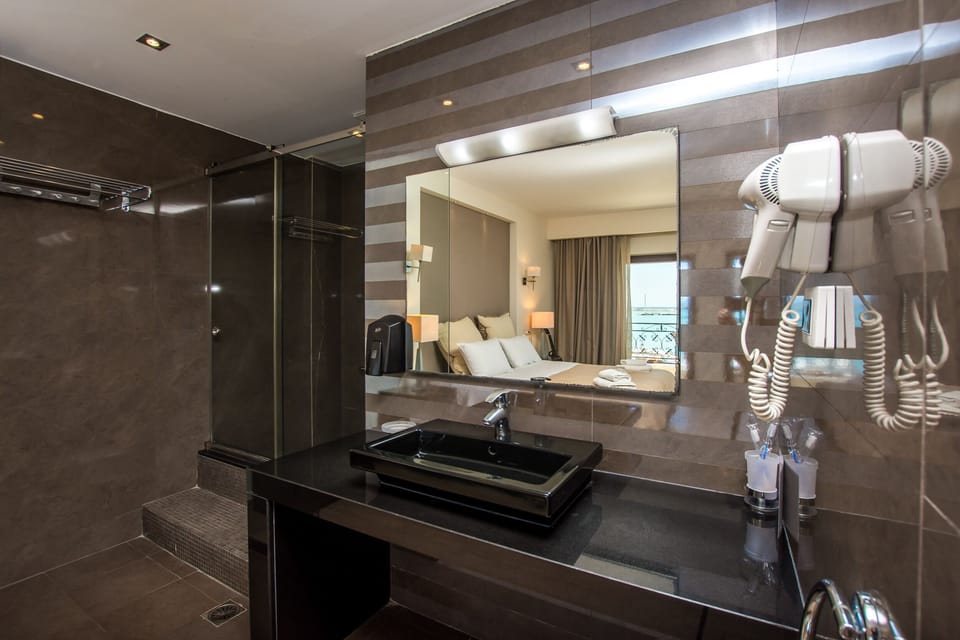 Honeymoon Suite, Sea View | Bathroom | Shower, free toiletries, hair dryer, slippers