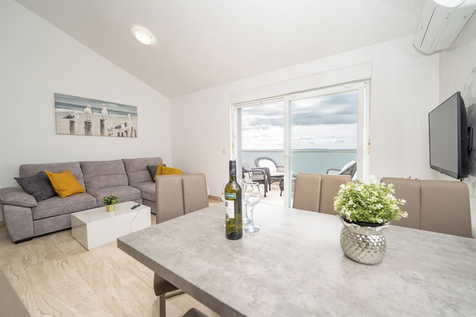 Standard Apartment, Patio, Sea View | Living area | 45-inch flat-screen TV with cable channels