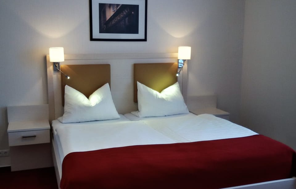 Premium bedding, desk, laptop workspace, blackout drapes