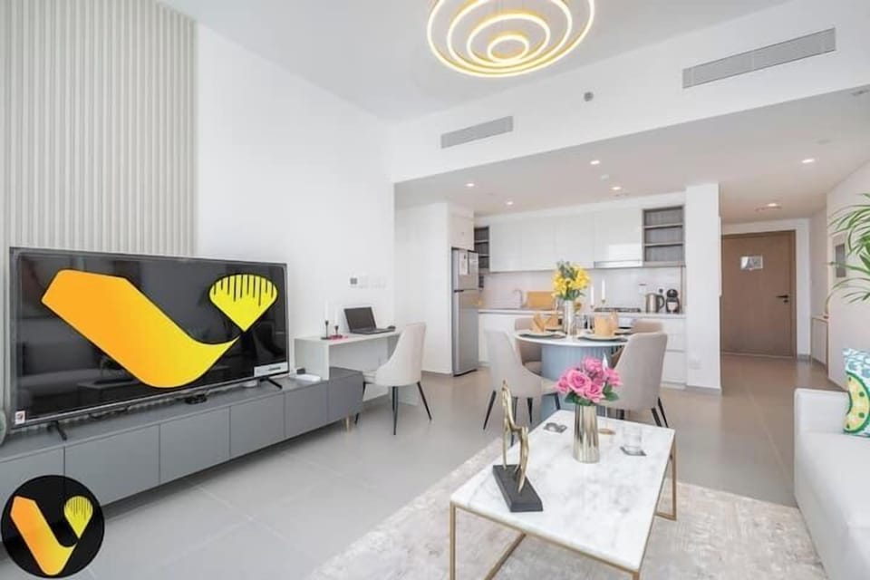 Luxury Apartment, Balcony, City View | Living area | 65-inch Smart TV with cable channels