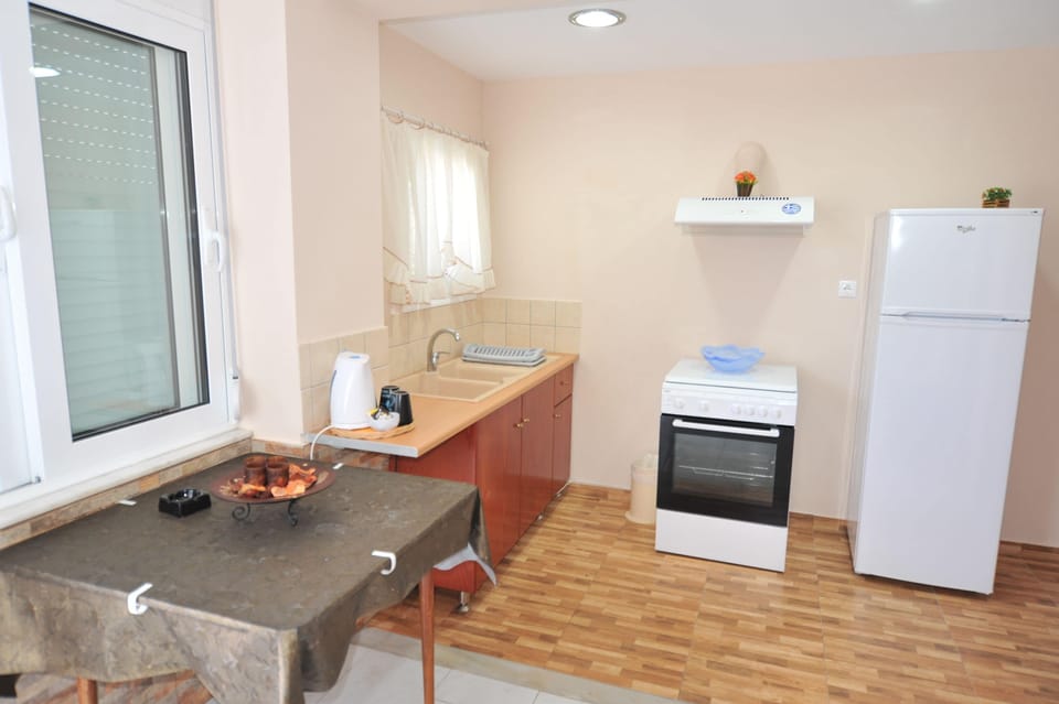 Family Apartment, 2 Bedrooms | Private kitchen | Fridge, stovetop, coffee/tea maker, electric kettle