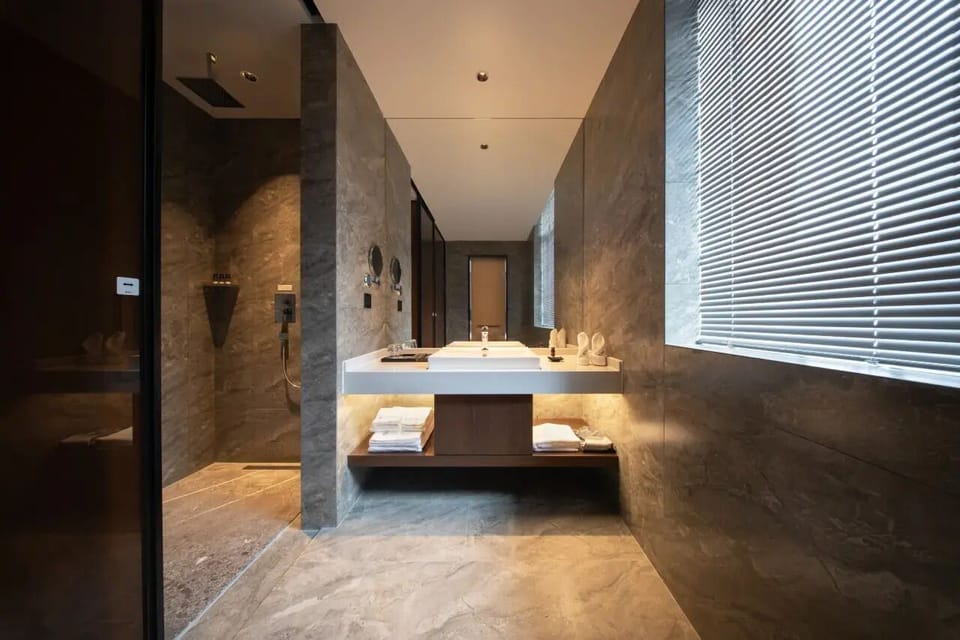Business Twin Room | Bathroom | Hair dryer, slippers, towels, soap