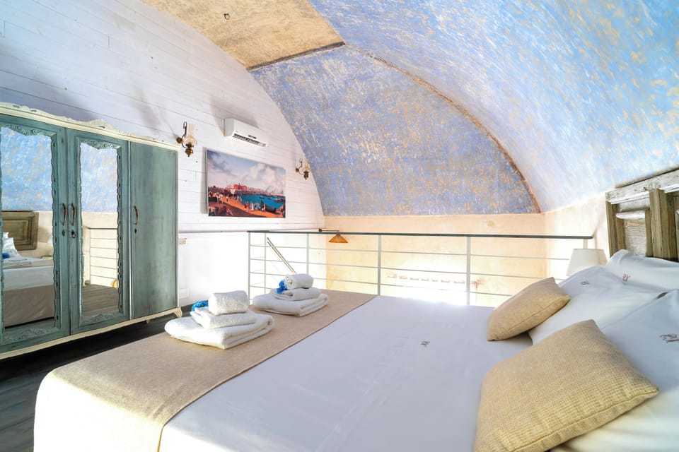 Suite, Balcony, Courtyard View | Minibar, blackout drapes, iron/ironing board, free cribs/infant beds