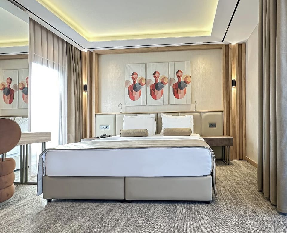 Standard Double Room, Balcony, Partial Sea View | In-room safe, desk, laptop workspace, blackout drapes