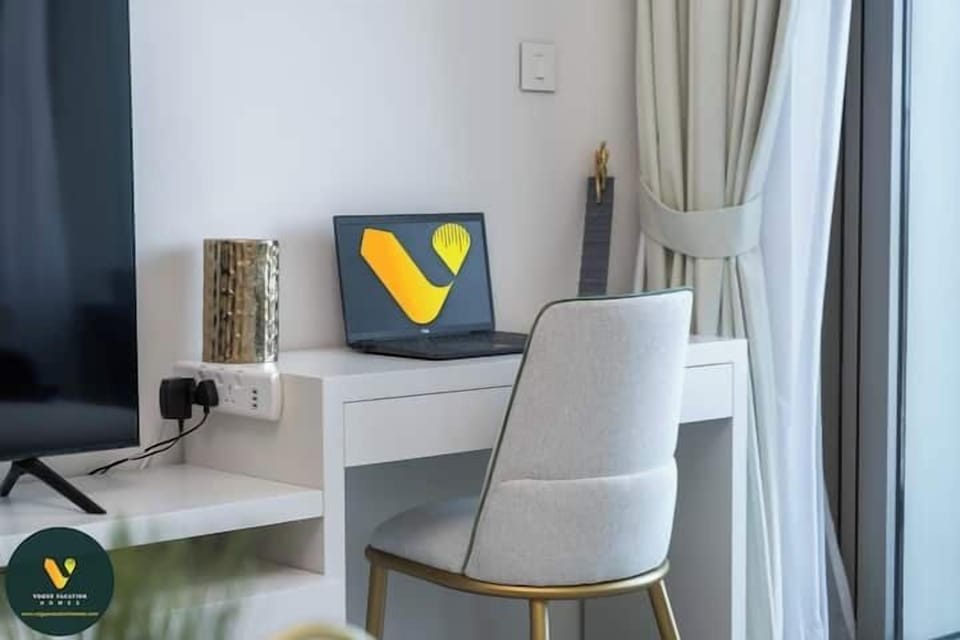 Luxury Apartment, Balcony, City View | Living area | 65-inch Smart TV with cable channels
