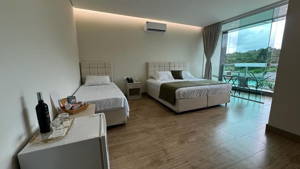 Deluxe Suite, Pool View | In-room safe, free WiFi