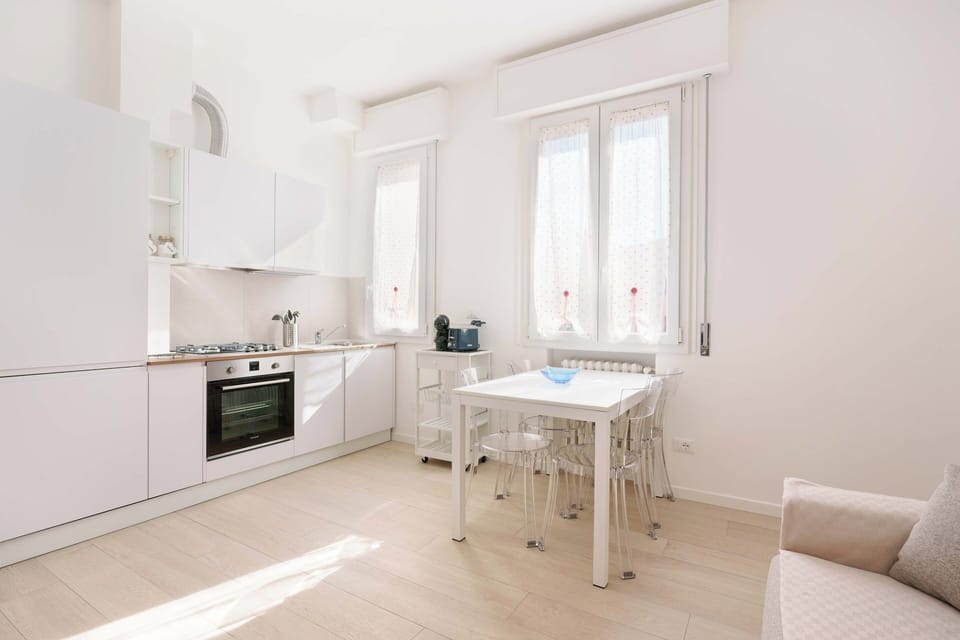 Apartment (Bilocale via cignani) | Private kitchen | Full-size fridge, oven, stovetop, dishwasher
