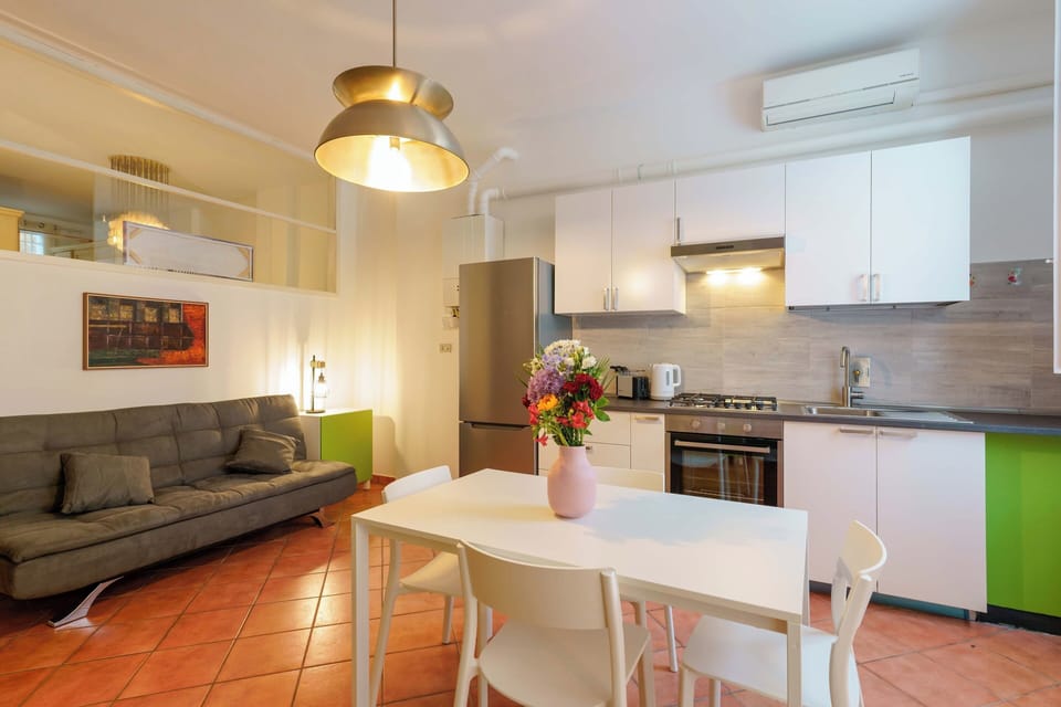Apartment (Zamboni 58) | Private kitchen | Full-size fridge, oven, stovetop, espresso maker