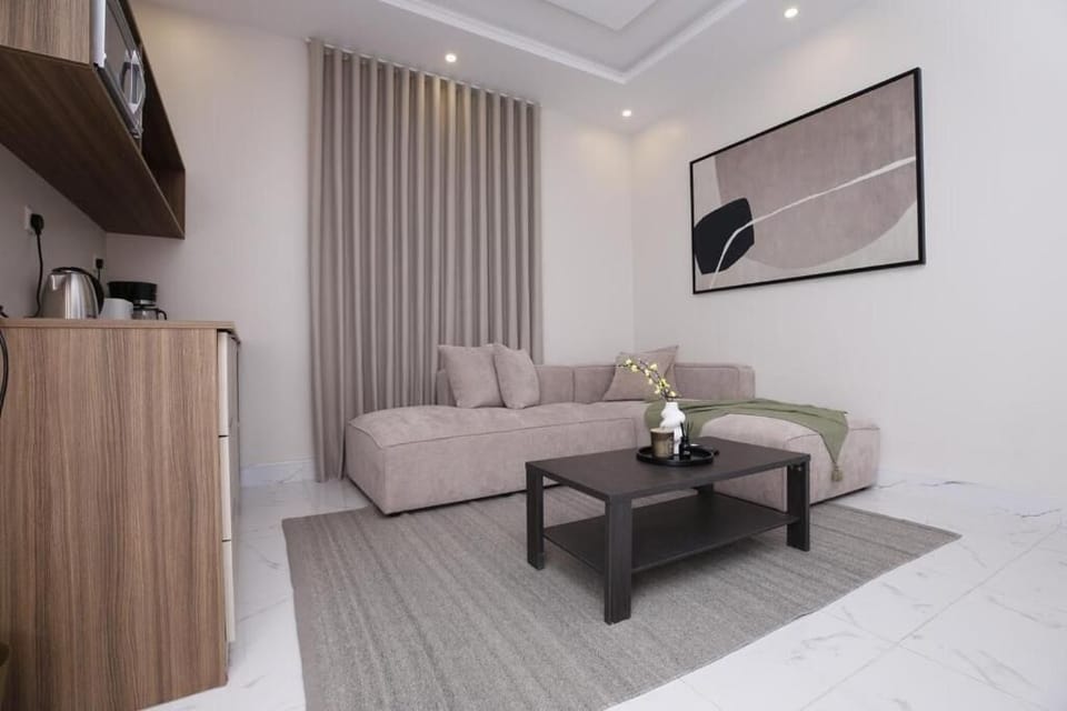 Deluxe Apartment, Non Smoking, Private Bathroom | Living area | 32-inch LED TV with satellite channels