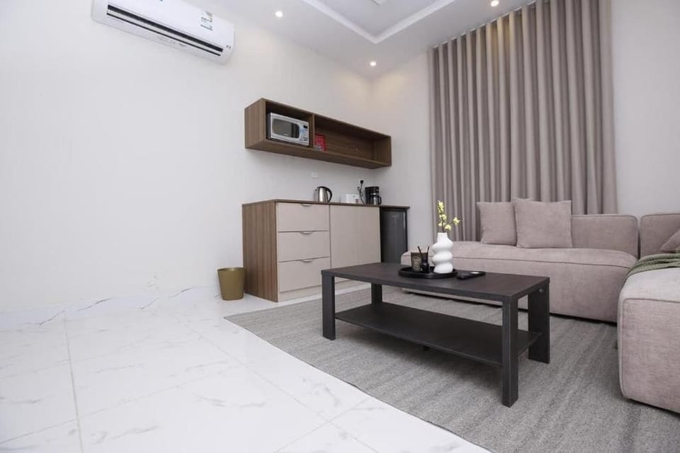 Deluxe Apartment, Non Smoking, Private Bathroom | Living area | 32-inch LED TV with satellite channels