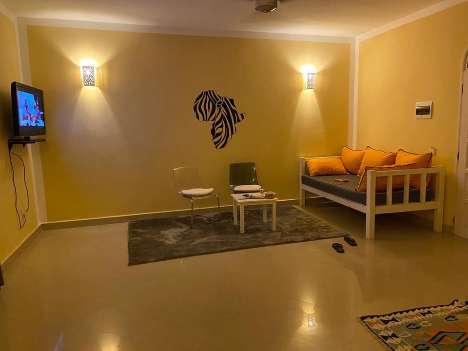 Family Villa, Balcony, Garden View | Living area | 32-inch Smart TV with digital channels