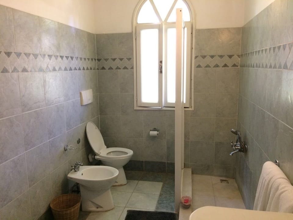 Family Villa, Balcony, Garden View | Bathroom | Shower, slippers, towels, soap