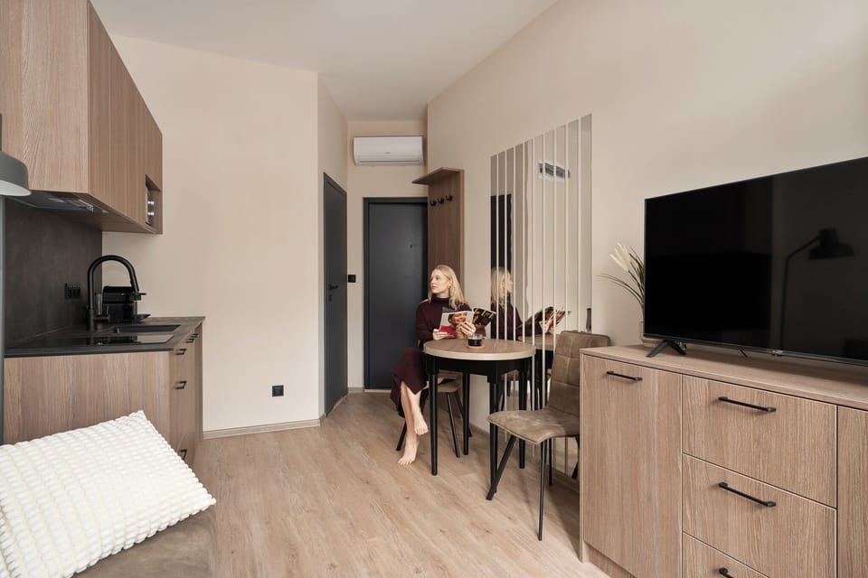 Deluxe Studio Suite, Balcony | Living area | Flat-screen TV