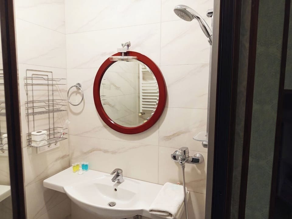 Economy Twin Room, Courtyard View | Bathroom | Slippers