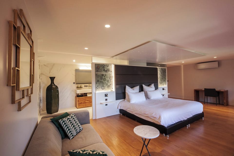 Deluxe Double Room, Garden View | Desk, laptop workspace, soundproofing, iron/ironing board