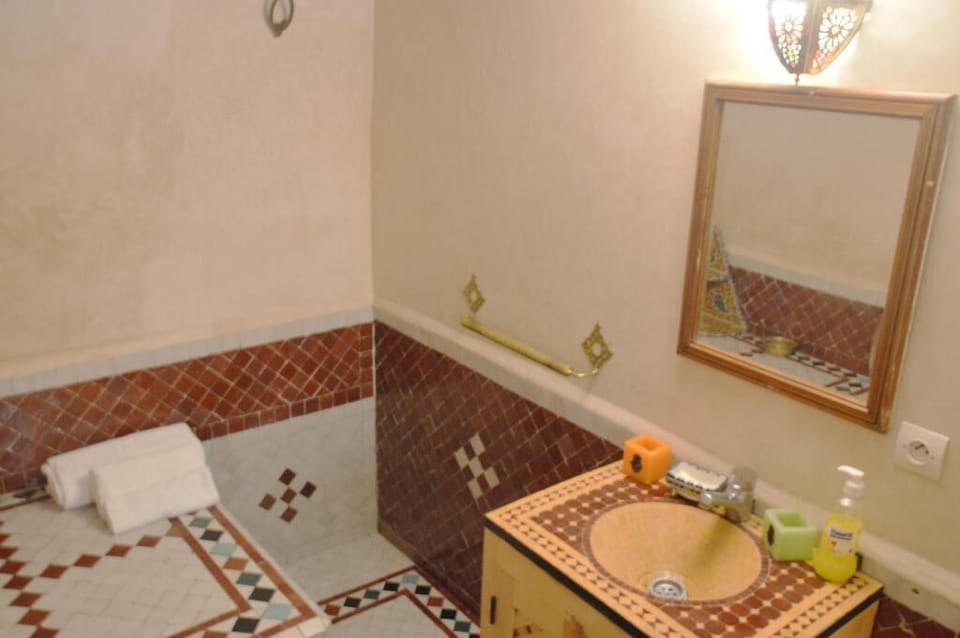 Shower, slippers, soap, toilet paper