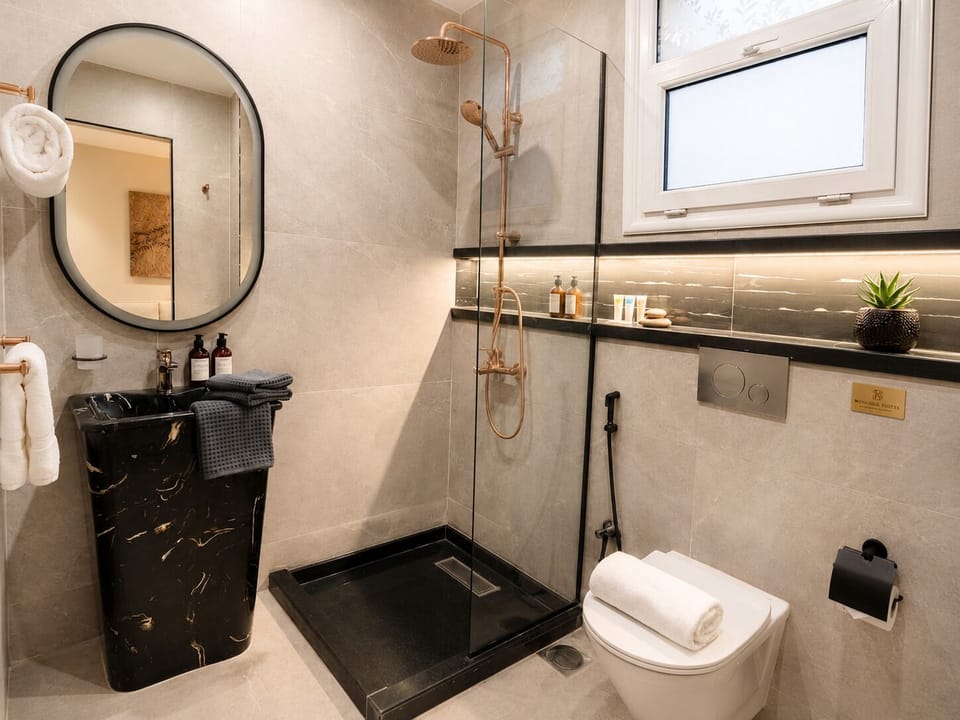 Family Suite, 2 Bedrooms | Bathroom | Shower, free toiletries, hair dryer, slippers