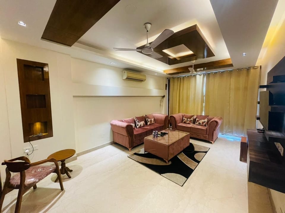 Apartment, Golf View | Living area | 43-inch Smart TV with digital channels