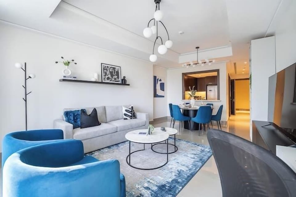 Luxury Apartment, Balcony, City View | Living area | 65-inch Smart TV with cable channels