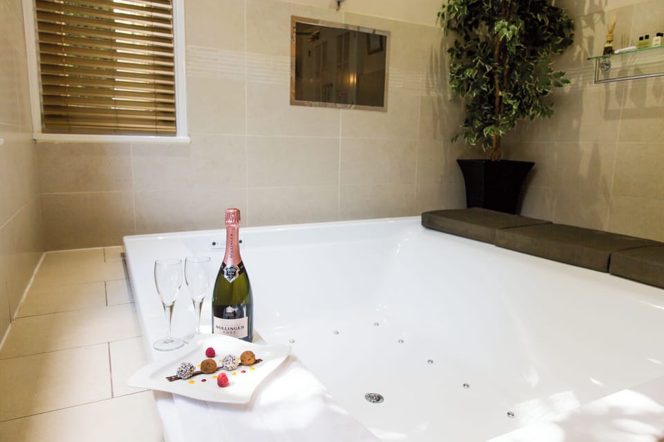 Signature Suite, Patio, Garden View | Bathroom | Separate tub and shower, hair dryer, towels, soap