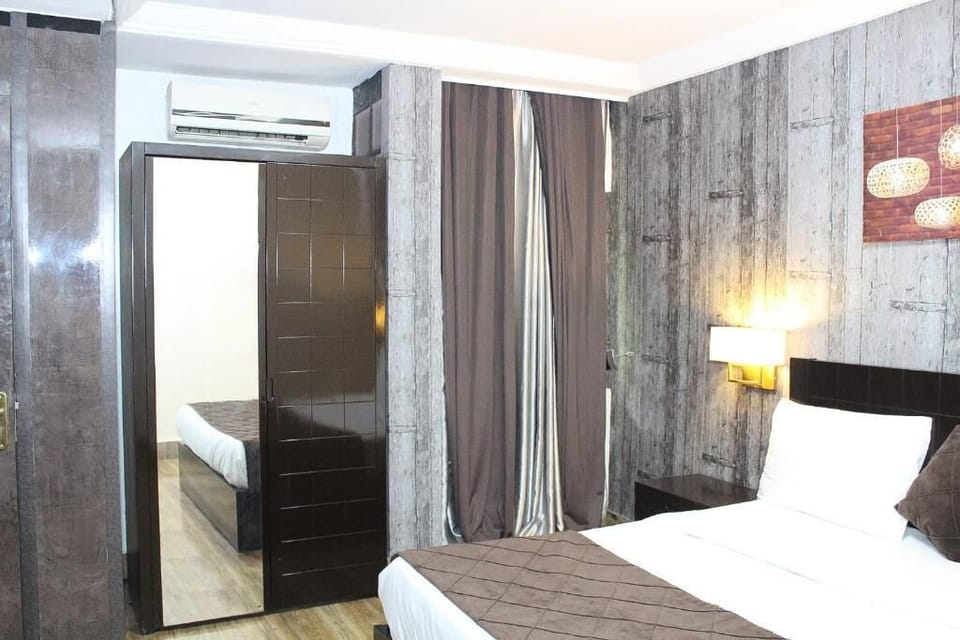 Deluxe Room, Balcony, City View | Desk, laptop workspace, blackout drapes, soundproofing