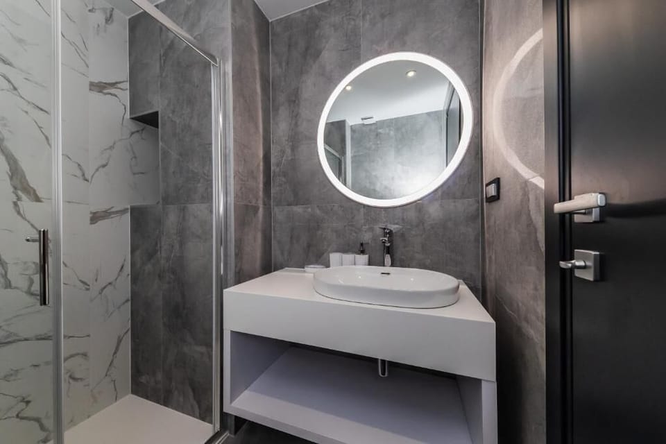 Shower, towels, soap, toilet paper