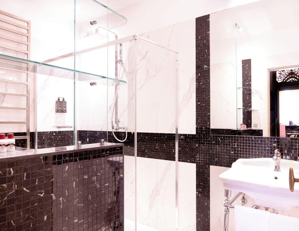 Superior Suite, Lagoon View | Bathroom | Shower, hair dryer, slippers, towels