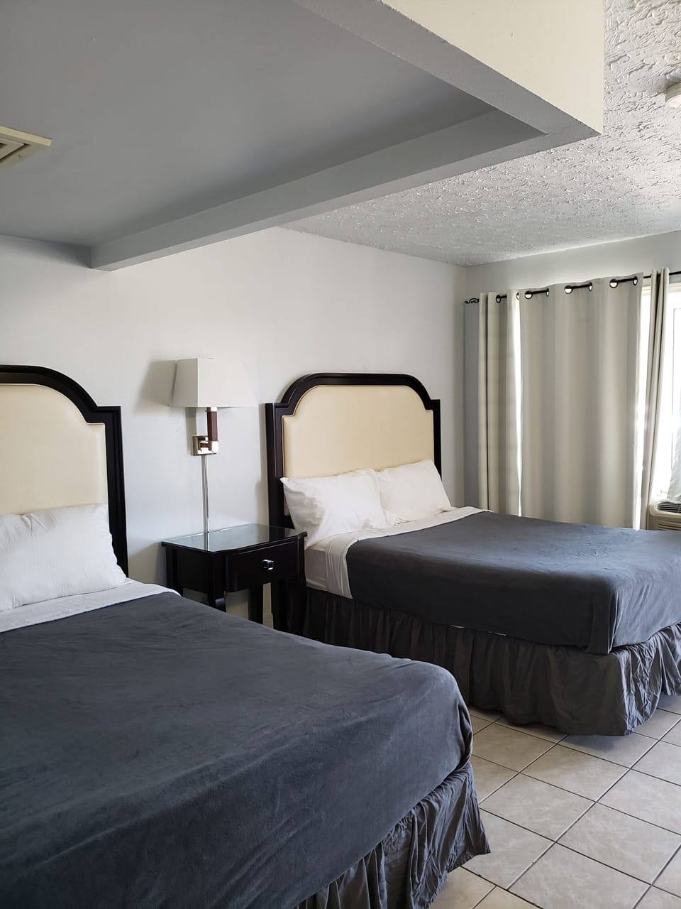 Standard Room, 2 Queen Beds | Desk, blackout drapes, free WiFi, bed sheets