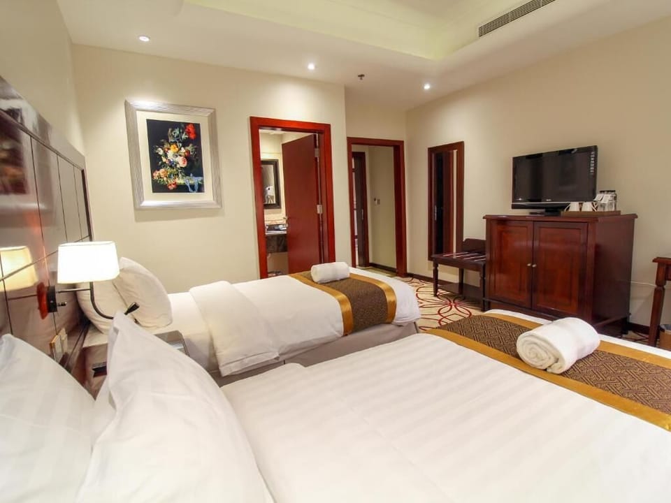 Deluxe Double or Twin Room, City View | Hypo-allergenic bedding, in-room safe, iron/ironing board, rollaway beds
