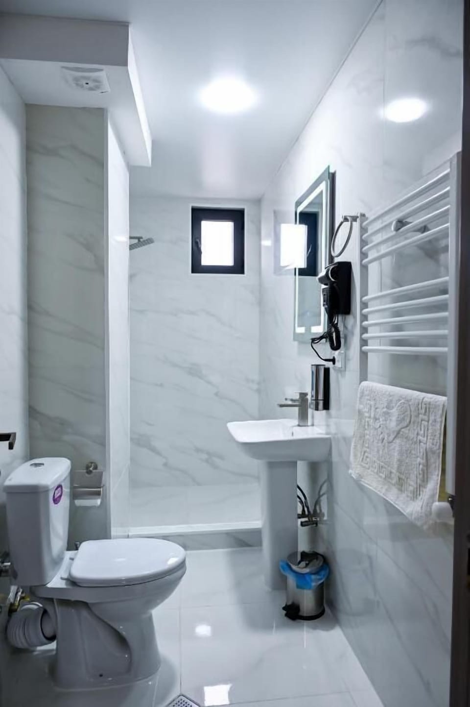 Separate tub and shower, free toiletries, hair dryer, slippers