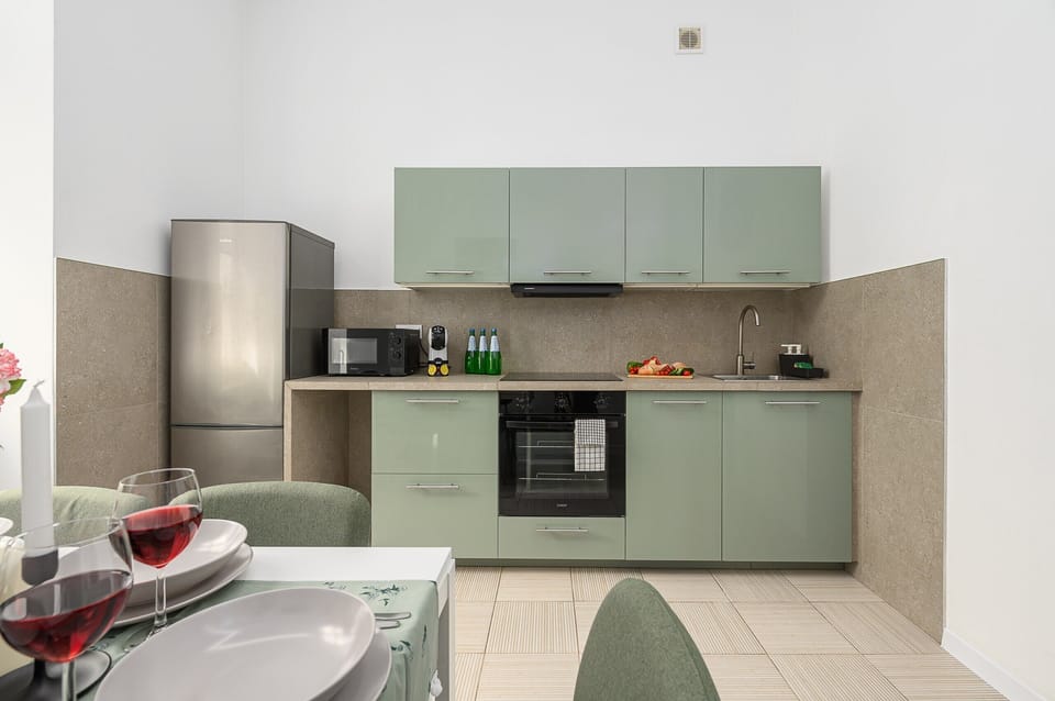 Comfort Apartment, Courtyard View | Private kitchen | Electric kettle, highchair