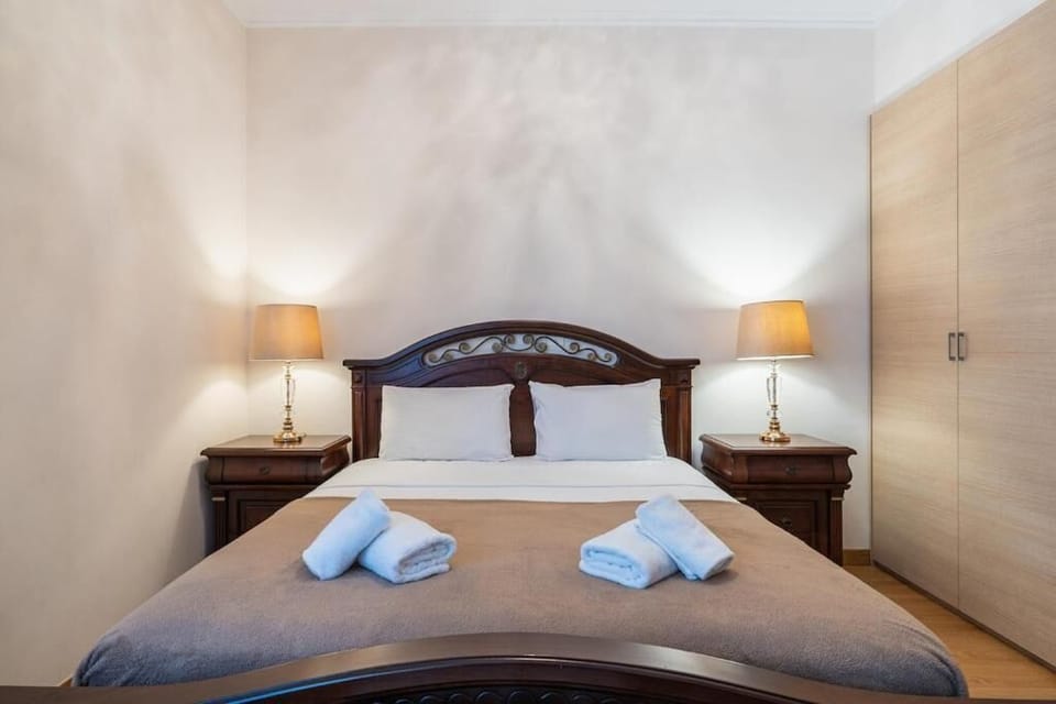 Apartment, Balcony, Garden View | In-room safe, desk, laptop workspace, iron/ironing board