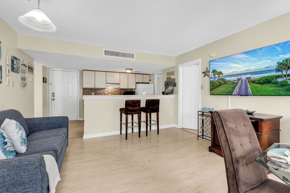 Signature Condo, 2 Bedrooms, Pool View | Living room | 45-inch Smart TV with cable channels