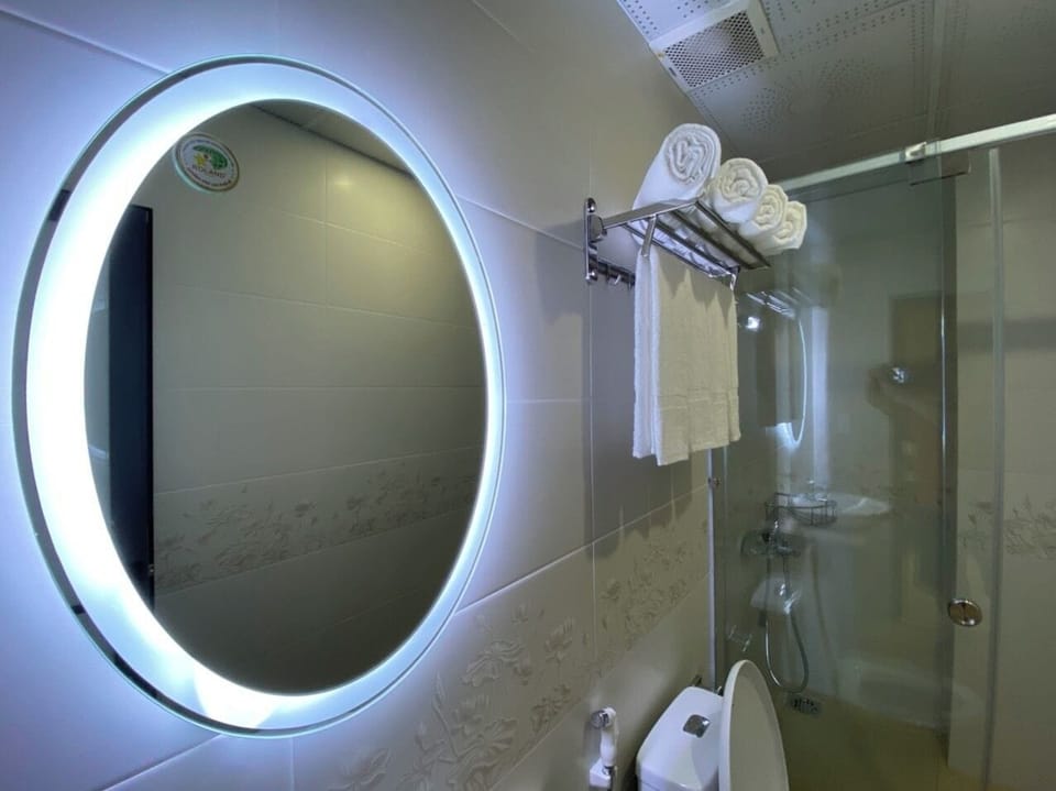 Quadruple Room | Bathroom | Shower, hair dryer, slippers, towels