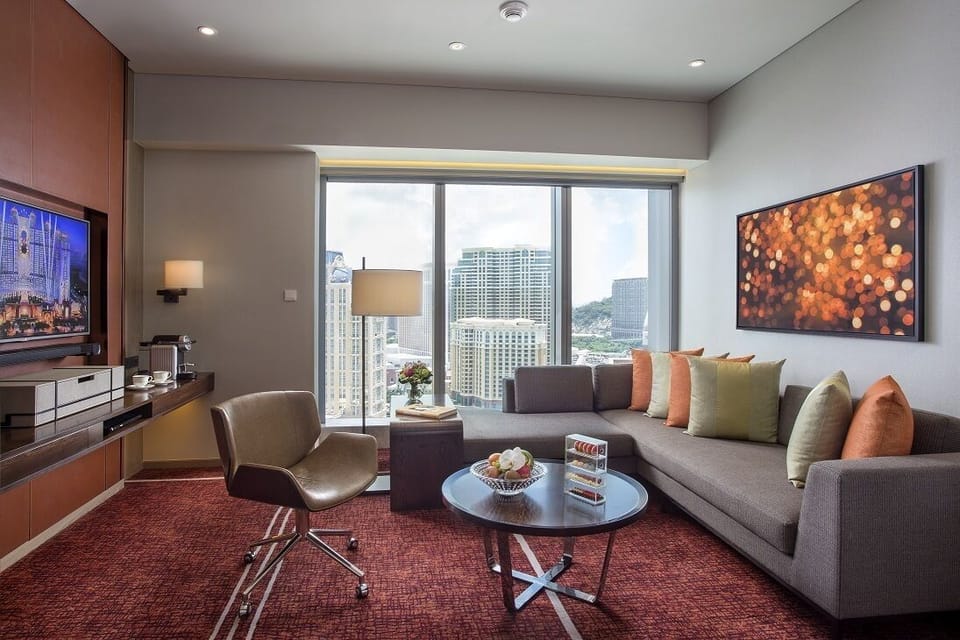 Celebrity Cotai Vista Suite | Living area | 55-inch LCD TV with digital channels, TV