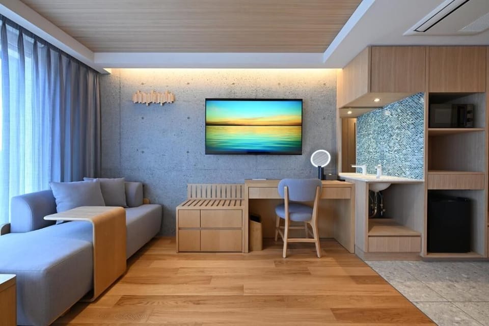 Superior Quadruple Room | Living area | 70-cm Smart TV with digital channels, Netflix, streaming services