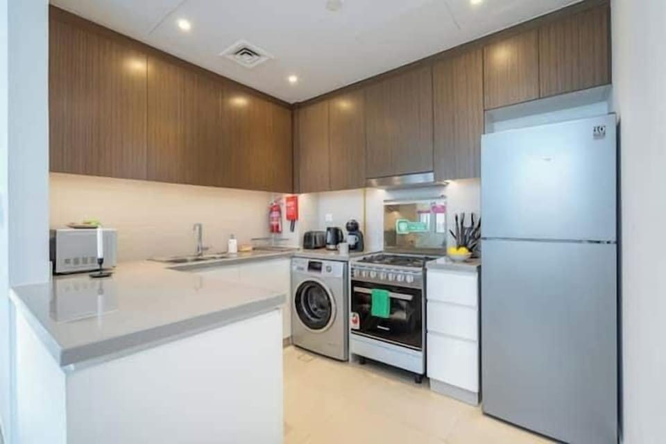 Premium Apartment, Balcony, Canal View | Private kitchen | Full-size fridge, microwave, oven, stovetop