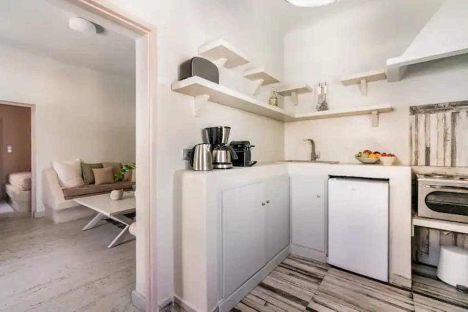 Deluxe Villa, 1 Bedroom, Jetted Tub, Sea View | Private kitchen | Stovetop, cookware/dishes/utensils, freezer, dining tables