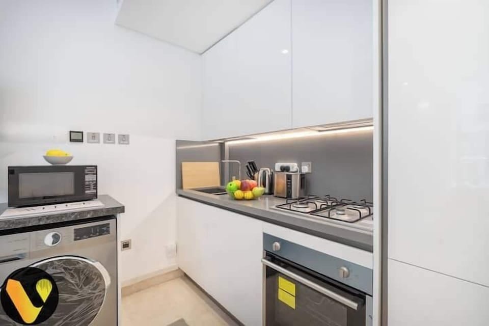 Luxury Apartment, Balcony, City View | Private kitchen | Full-size fridge, microwave, oven, stovetop