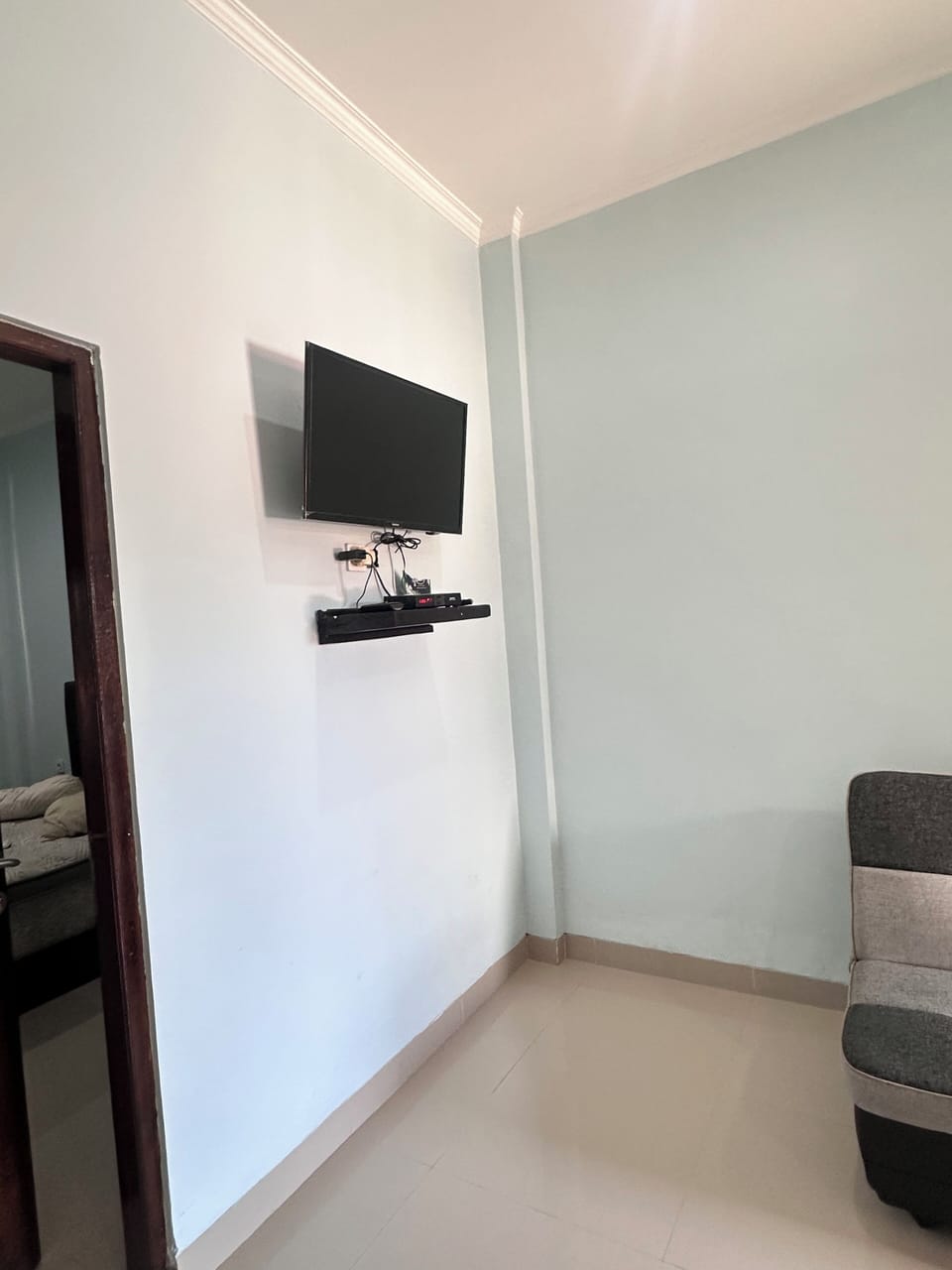 Double Room, Refrigerator | Living area | 24-inch LCD TV with cable channels