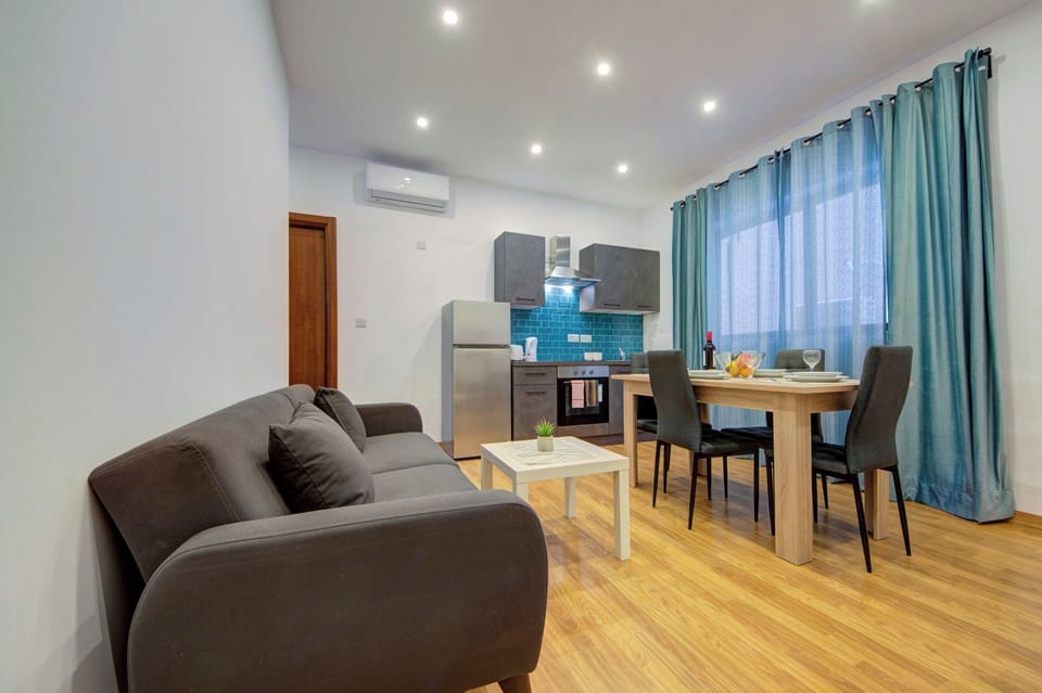 Apartment (1 Bedroom) | Living area | TV
