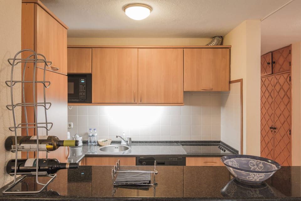 Apartment, 2 Bedrooms, Balcony, Pool View | Private kitchenette | Full-size fridge, microwave, oven, stovetop