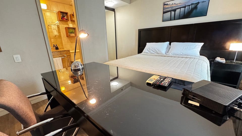 Deluxe Double Room | Minibar, desk, blackout drapes, iron/ironing board