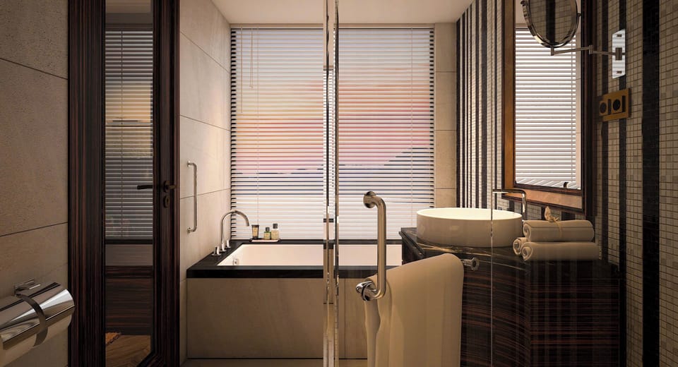 Separate tub and shower, hydromassage showerhead, designer toiletries