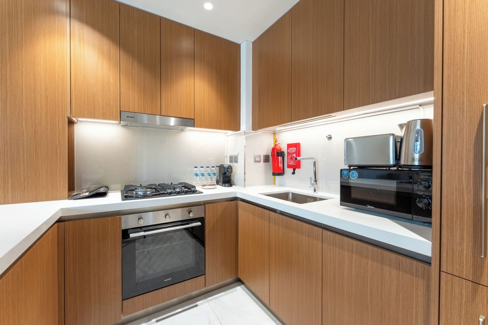 Exclusive Apartment, 1 King Bed, Balcony, Pool View | Private kitchen | Fridge, microwave, oven, stovetop