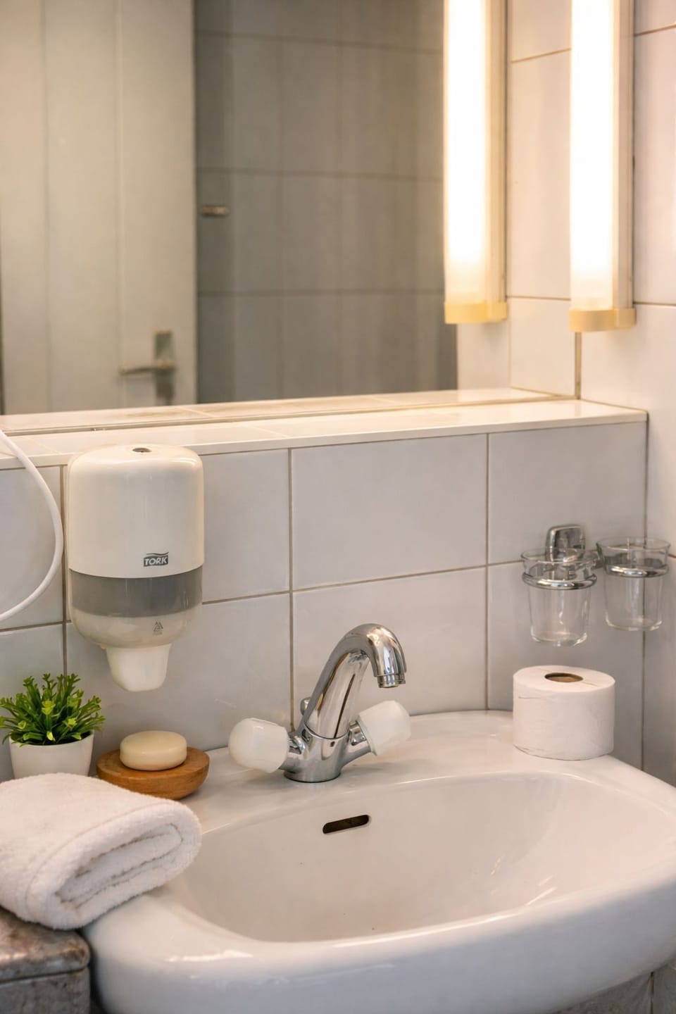 Shower, hair dryer, towels, toilet paper