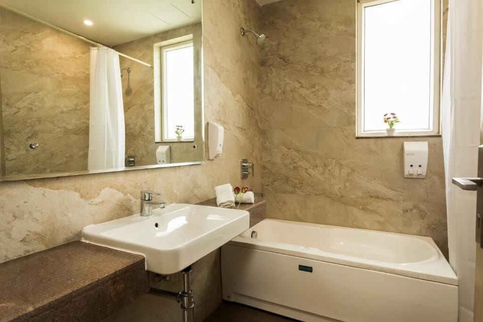 Family Suite, City View | Bathroom | Shower, free toiletries, towels, soap